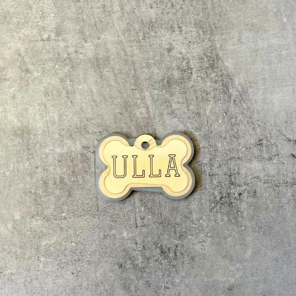 Rubber frame for dog tags so it doesn't make noise (large meat bone)